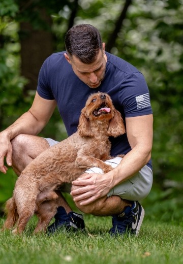 Steve Del Savio with a young Cavapoo